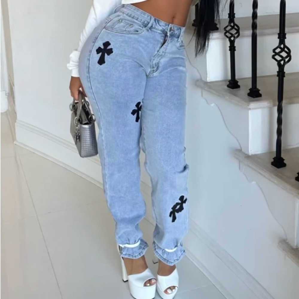Blue jeans with a few black embroidery. Size medium